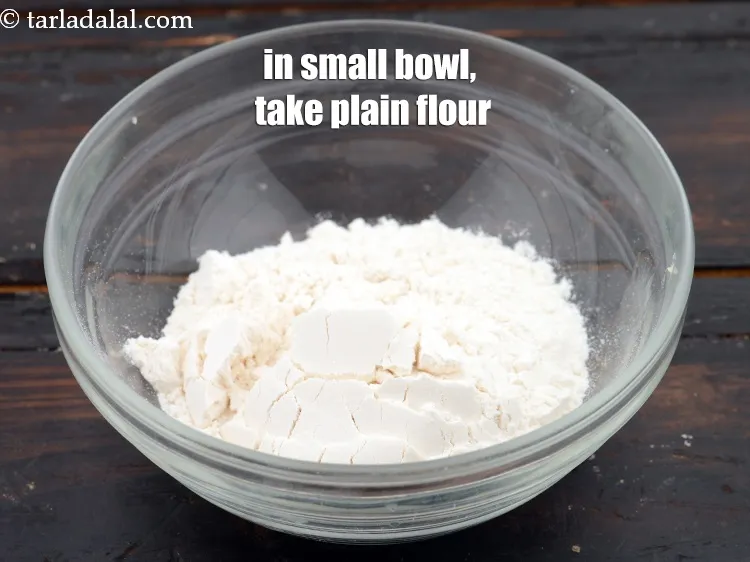 Step 13 – In a small bowl, take 2 tbsp&nbsp;<a href="https://www.tarladalal.com/glossary-plain-flour-maida-188i">plain flour (maida)</a>.