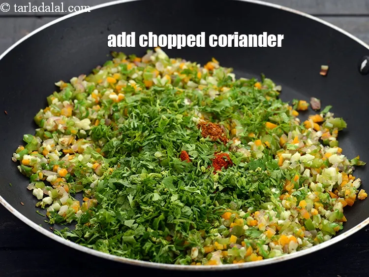 Step 13 – Add 2 tbsp&nbsp;<a href="https://www.tarladalal.com/glossary-chopped-coriander-783i">chopped coriander (dhania)</a>.