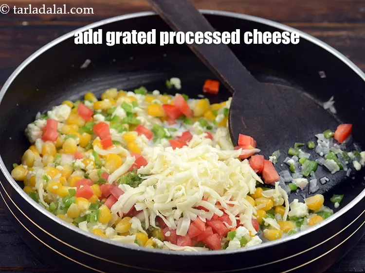 Step 13 – Add 1/4 cup&nbsp;<a href="https://www.tarladalal.com/glossary-grated-processed-cheese-868i">grated processed cheese</a>.&nbsp;