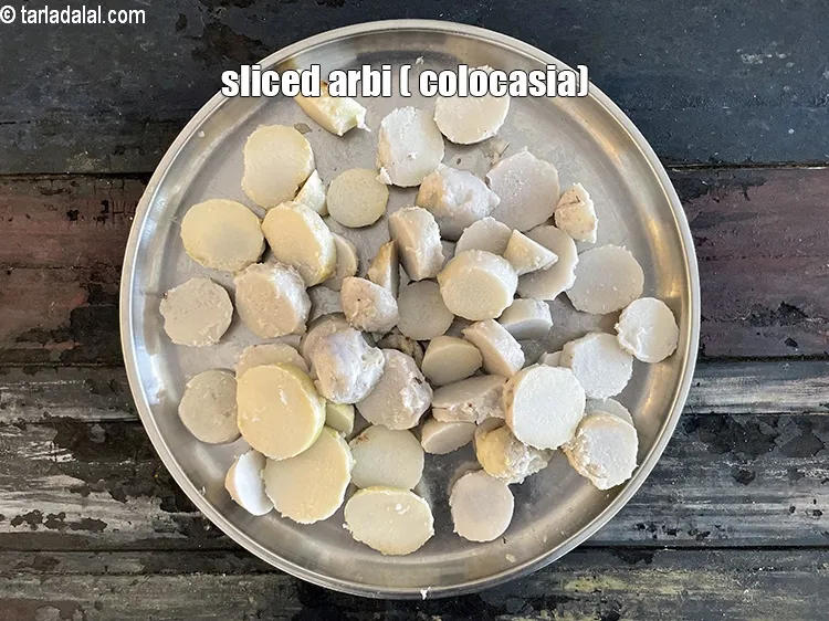 Step 23 – Slice the arbi with a knife. Sliced arbi (colocasia).