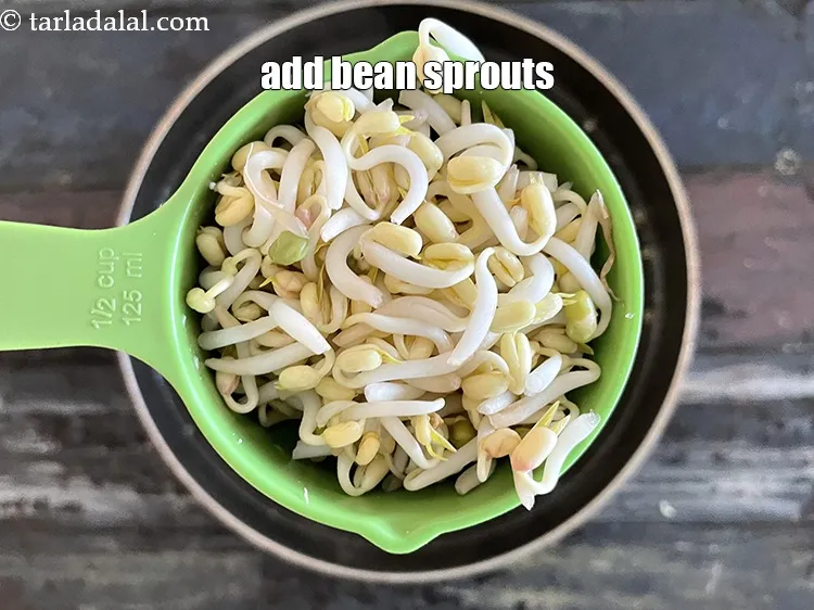 Step 26 – Add&nbsp;<meta charset="UTF-8" />1/2 cup&nbsp;<a href="glossary-bean-sprouts-193i">bean sprouts</a>.