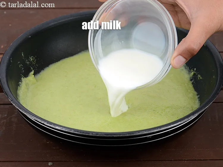 Step 13 – Add &frac12; cup&nbsp;<a href="https://www.tarladalal.com/glossary-milk-doodh-full-cream-milk-514i">milk</a>.