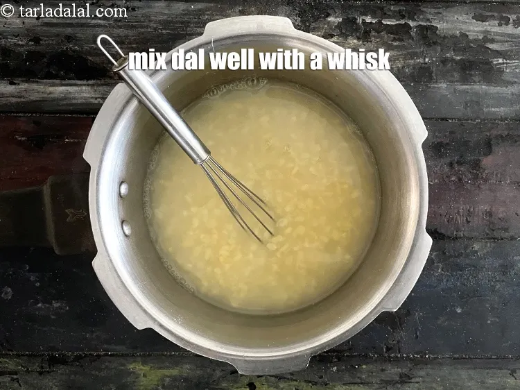 Step 13 – Mix the dal very well with help of a whisk.