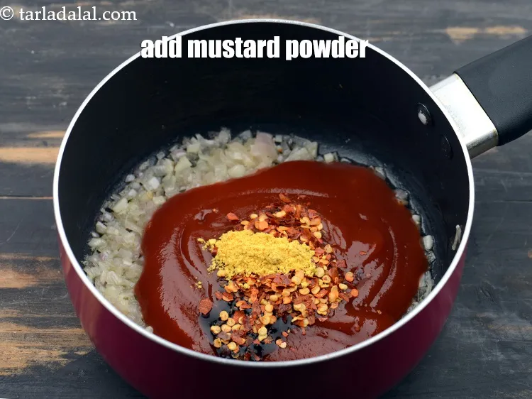 Step 14 – Add 1 tsp&nbsp;<a href="https://www.tarladalal.com/glossary-mustard-powder-rai-powder-sarson-powder-powdered-sarson-526i">mustard (rai / sarson) powder</a>.