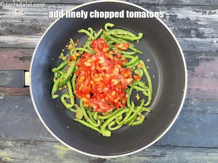 Step 20 – Add&nbsp;<meta charset="UTF-8" />3/4 cup&nbsp;finely&nbsp;<a href="glossary-chopped-tomatoes-779i">chopped tomatoes</a>.