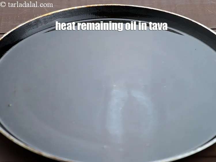 Step 13 – Heat the remaining 2 tbsp of oil in the same non-stick tava (griddle).