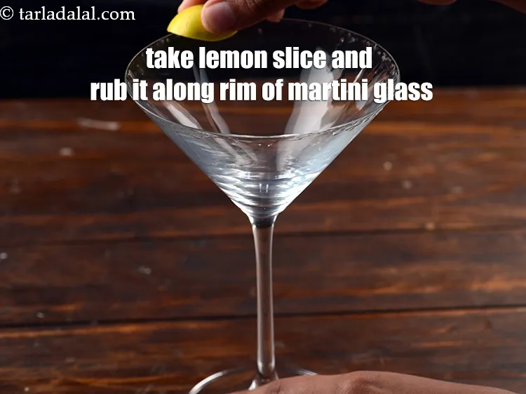 Step 12 – Take a lemon slice and rub it along the rim of the martini glass.