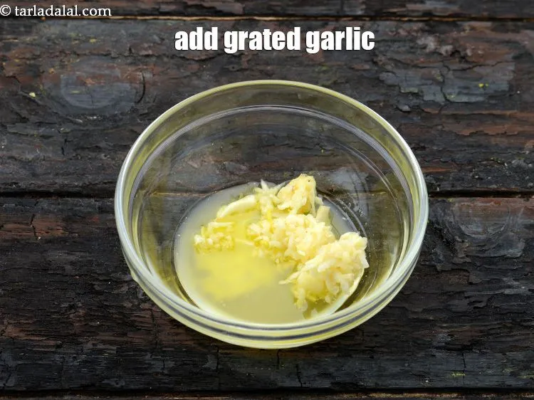 Step 13 – Add 1 1/2 tsp&nbsp;<a href="https://www.tarladalal.com/glossary-grated-garlic-859i">grated garlic (lehsun)</a>.&nbsp;