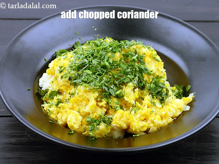 Step 14 – Add 1/4 cup&nbsp;finely&nbsp;<a href="https://www.tarladalal.com/glossary-chopped-coriander-783i">chopped coriander (dhania)</a>.&nbsp;