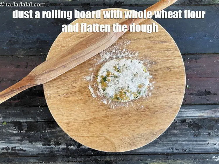 Step 13 – Dust a rolling board with some flour and flatten the dough.