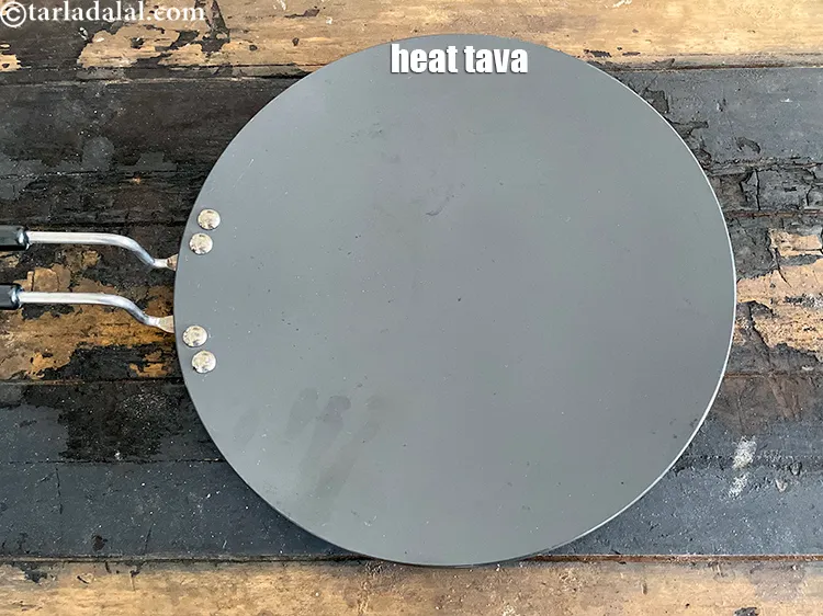 Step 24 – Heat a non stick tava or roti tava.