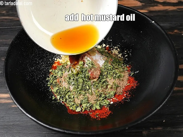 Step 15 – &nbsp;Add 2 tbsp hot <a href="https://www.tarladalal.com/glossary-mustard-oil-rai-ka-tel-sarson-ka-tel-942i">mustard (rai / sarson) oil</a>.