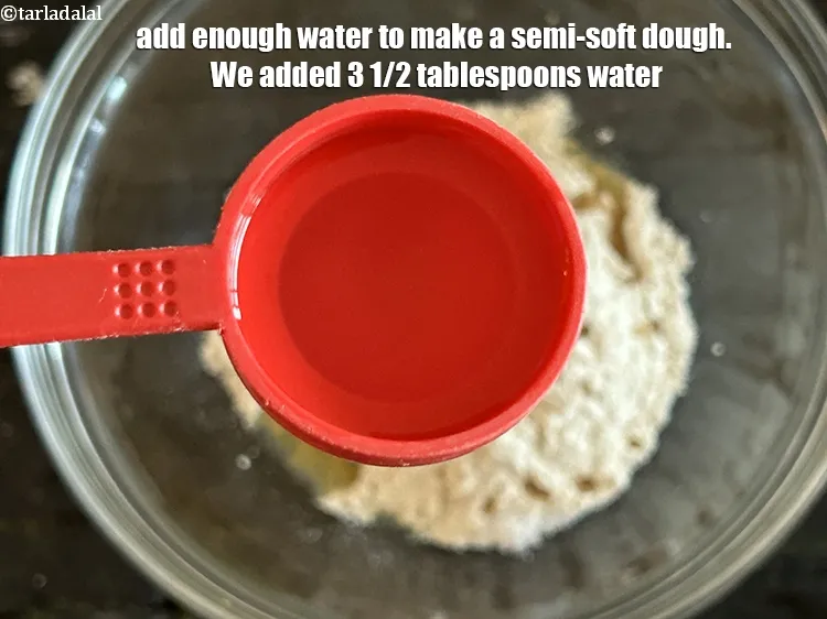 Step 13 – Add enough water to make a semi-soft dough. We added 31/2 tablespoons water.