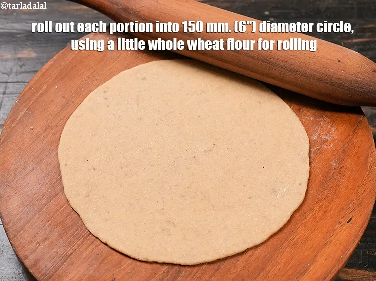 Step 14 – Roll out each portion into 150 mm. (6&quot;) diameter circle, using a little whole wheat …