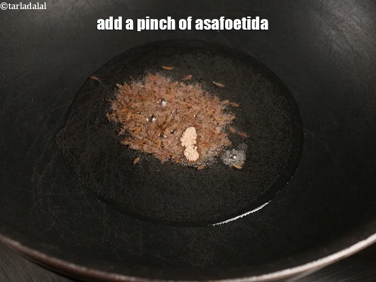 Step 14 – Add&nbsp;a pinch of <a href="https://www.tarladalal.com/glossary-asafoetida-hing-113i">asafoetida (hing)</a>.