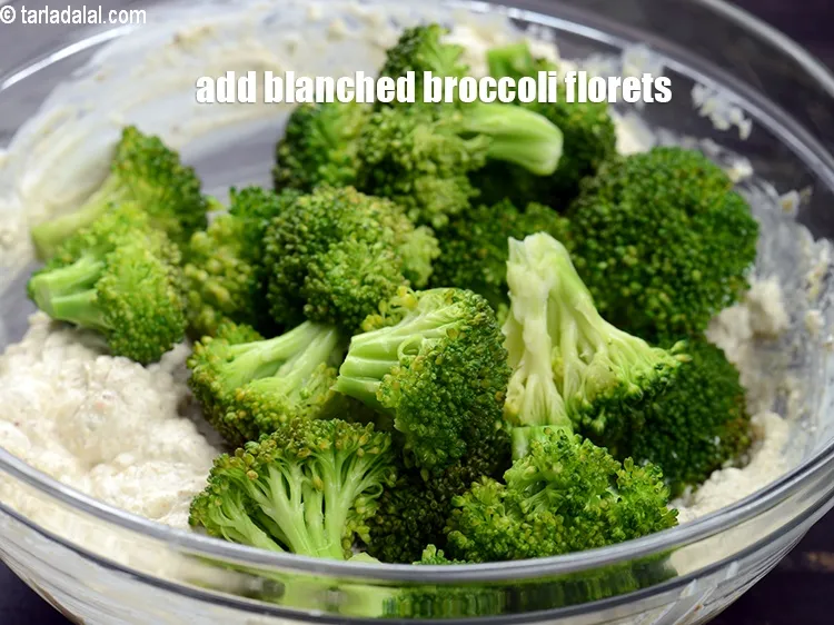 Step 14 – Add 2 &frac12; cup <a href="https://www.tarladalal.com/glossary-blanched-broccoli-florets-719i">blanched broccoli florets</a>.