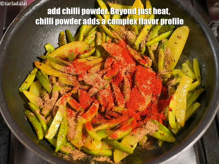 Step 14 – Add 1 tsp&nbsp;<a href="https://www.tarladalal.com/glossary-chilli-powder-red-chilli-powder-339i">chilli powder</a>.&nbsp;Beyond just heat, chilli powder adds a complex flavor profile.