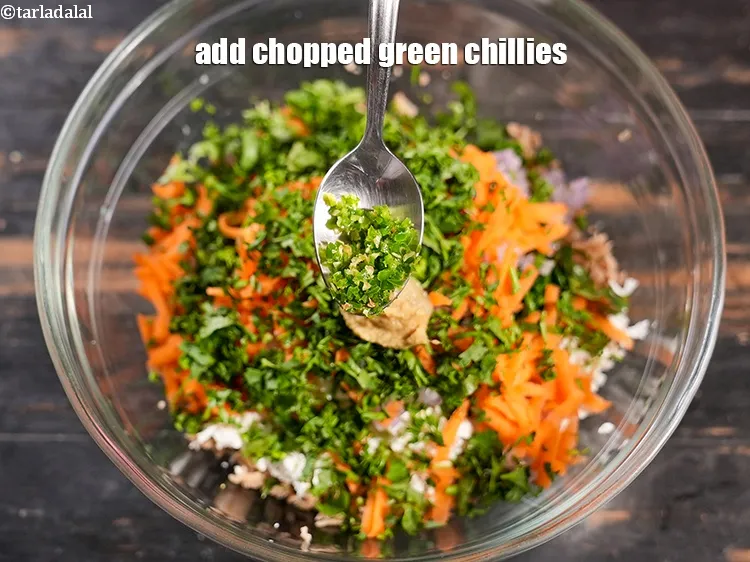 Step 15 – Add &frac12; tsp <a href="https://www.tarladalal.com/glossary-chopped-green-chilli-820i">chopped green chillies</a>.