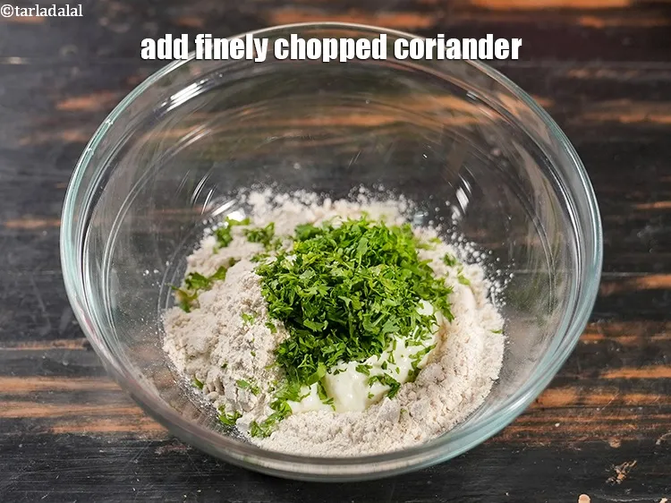 Step 13 – Add 1 tbsp finely <a href="https://www.tarladalal.com/glossary-chopped-coriander-783i">chopped coriander (dhania)</a>.