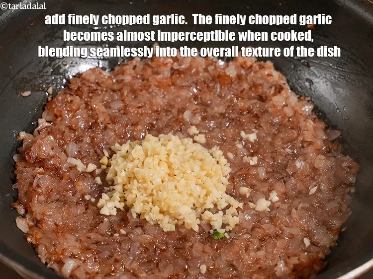 Step 14 – Add 2 tbsp finely <a href="https://www.tarladalal.com/glossary-chopped-garlic-790i">chopped garlic (lehsun)</a>. &nbsp;The finely chopped garlic becomes almost imperceptible …