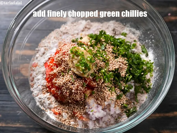 Step 14 – Add 1 tsp finely <a href="https://www.tarladalal.com/glossary-chopped-green-chilli-820i">chopped green chillies</a>.