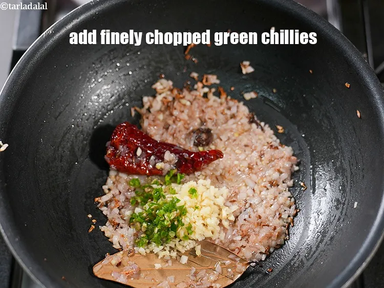 Step 14 – Add 2 tsp finely&nbsp;<a href="https://www.tarladalal.com/glossary-chopped-green-chilli-820i">chopped green chillies</a>.&nbsp;