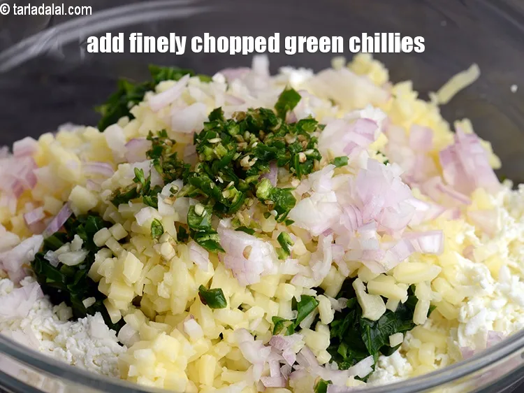 Step 16 – Add 1&frac12; tsp finely <a href="https://www.tarladalal.com/glossary-chopped-green-chilli-820i">chopped green chillies</a>.