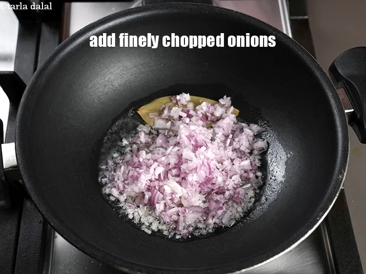 Step 19 – Add 1 cup finely <a href="https://www.tarladalal.com/glossary-chopped-onions-722i">chopped onions</a>.