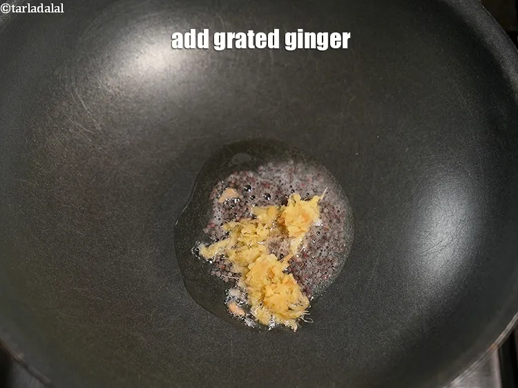 Step 14 – Add 1 tsp <a href="https://www.tarladalal.com/glossary-grated-ginger-943i">grated ginger (adrak)</a>.
