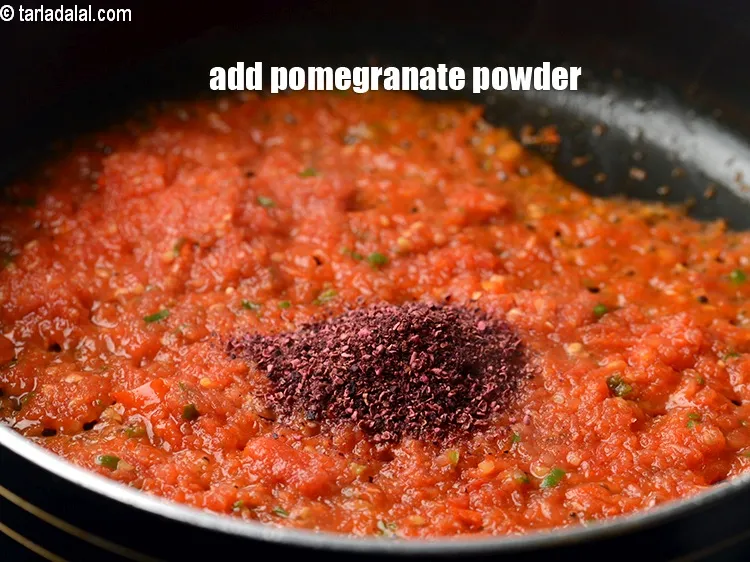 Step 14 – Add &frac12; tbsp <a href="https://tarladalal.com/glossary-pomegranate-powder-anardana-powder-1221i">pomegranate (anardana) powder</a>.