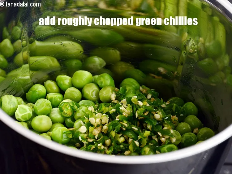 Step 15 – Add 2 tsp roughly <a href="https://www.tarladalal.com/glossary-chopped-green-chilli-820i">chopped green chillies</a>.&nbsp;
