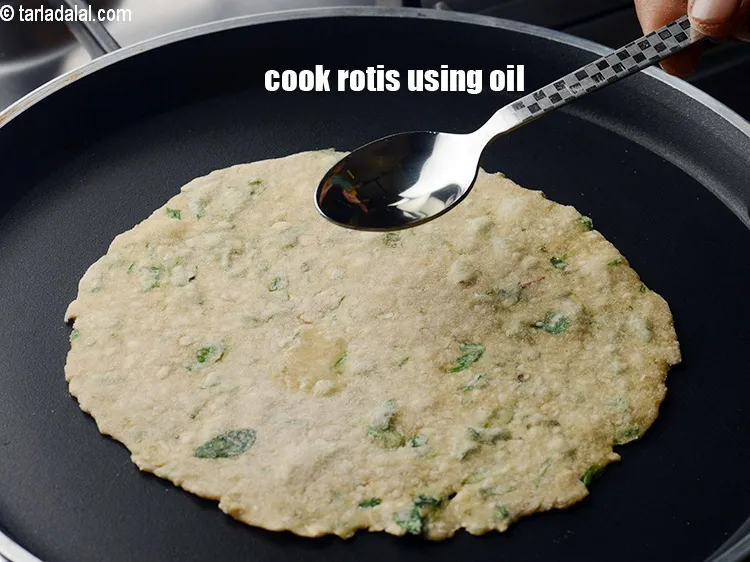 Step 14 – Cook the rotis using 1 tsp of oil, till light brown spots appear on both …