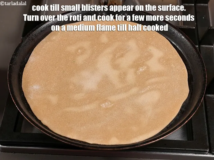 Step 20 – Heat a non-stick tava (griddle) on a high flame and place the roti on it. …
