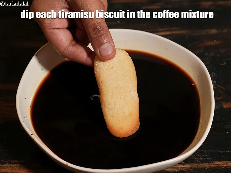 Step 14 – <p>Dip each tiramisu biscuit in the coffee mixture.</p>