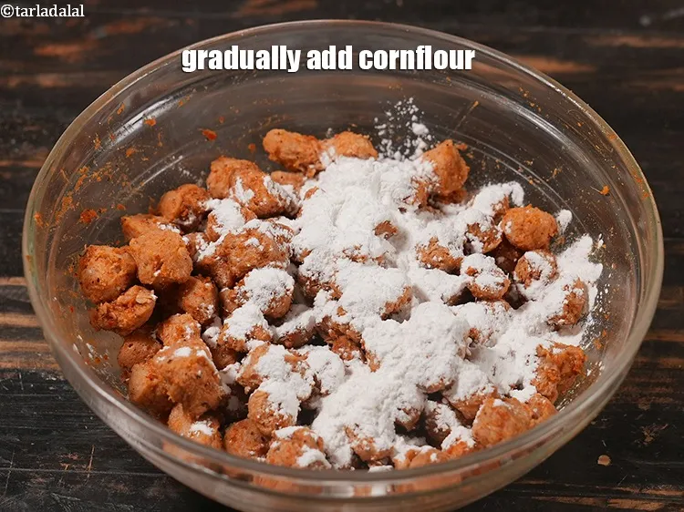 Step 14 – Gradually add &frac14; cup <a href="https://www.tarladalal.com/glossary-cornflour-cornstarch-maize-starch-corn-flour-112i">cornflour</a>.&nbsp;