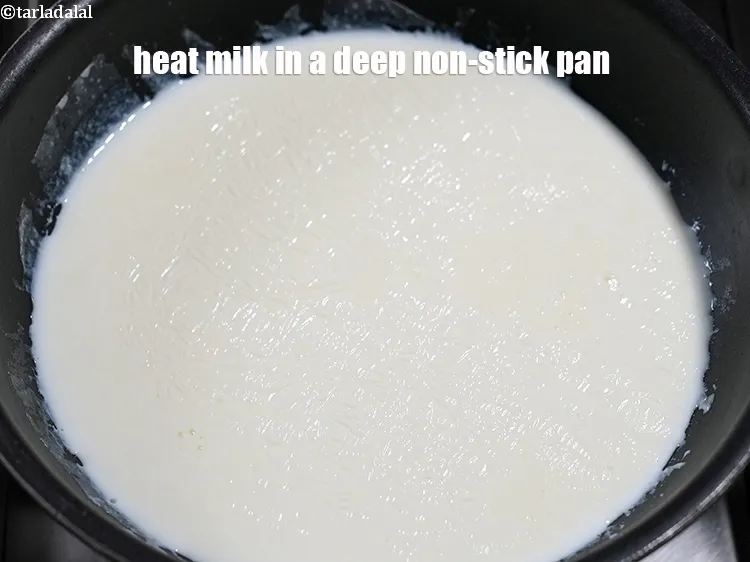 Step 14 – Meanwhile heat 3 cups of milk in a deep non-stick pan.