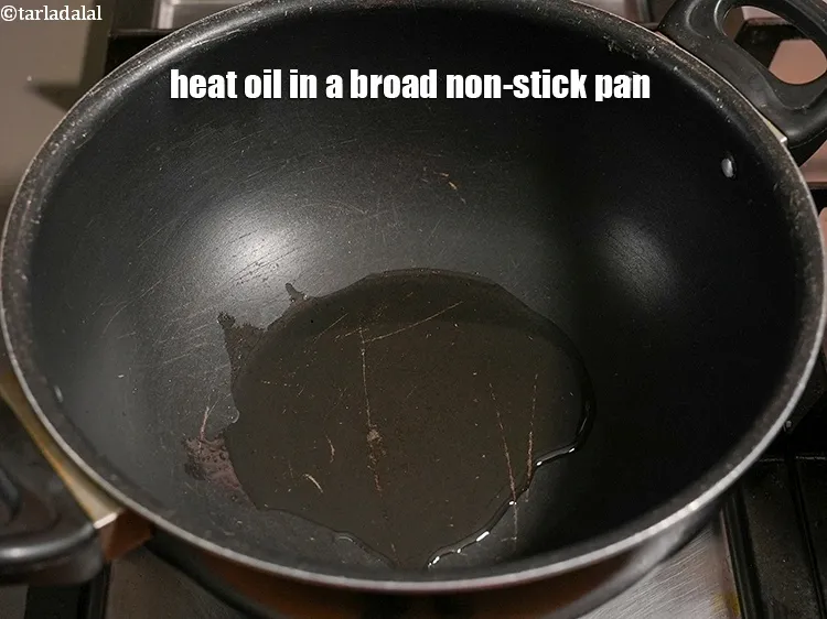 Step 14 – Heat 1 tbsp oil in a broad non-stick pan.