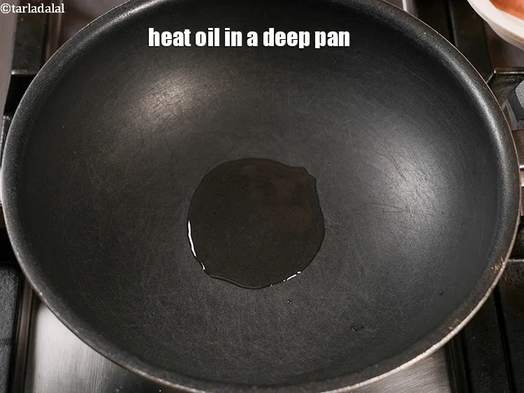 Step 14 – Heat 1 tsp <a href="https://www.tarladalal.com/glossary-oil-671i">oil</a> in a deep pan.