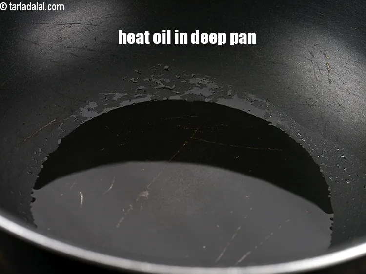 Step 15 – Heat 2 tsp oil in a deep non-stick pan.