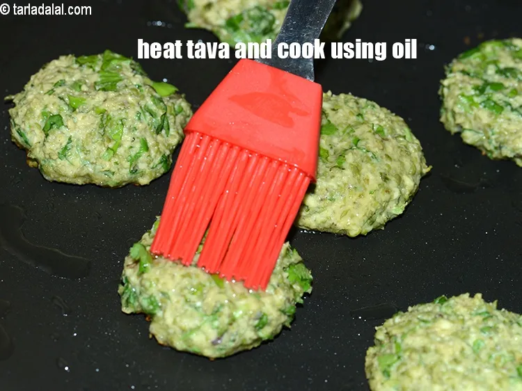 Step 15 – Heat a non-stick tava (griddle), and cook each tikki, using 1/8 tsp oil.