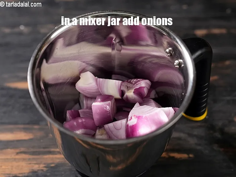 Step 21 – In a mixer jar add 1 cup roughly chopped onions.
