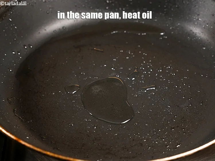 Step 14 – In the same pan, heat 1 tbsp oil.