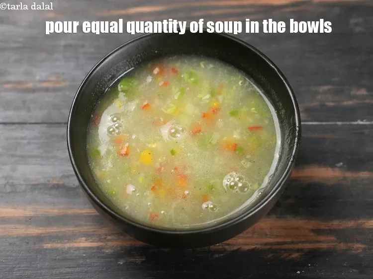 Step 15 – Remove off the flame, just before serving, pour equal quantity of soup in the bowls.