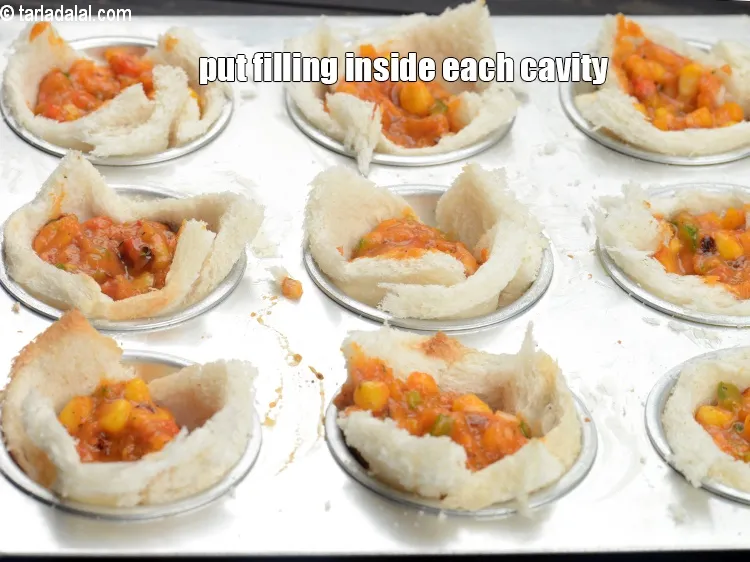 Step 14 – Put 1 tbsp of the prepared filling inside each cavity.&nbsp;