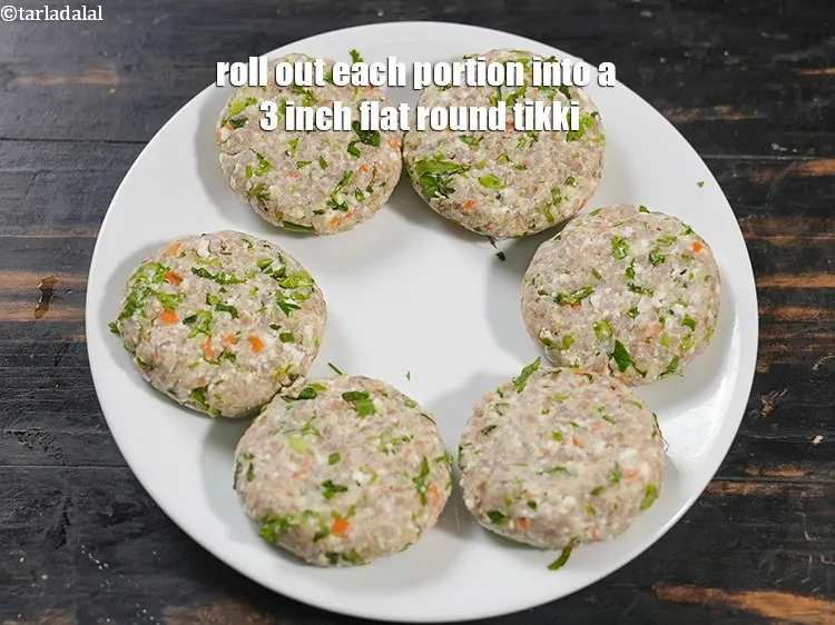 Step 13 – Roll out each portion into a 75 mm. (3 inch) flat round tikki.