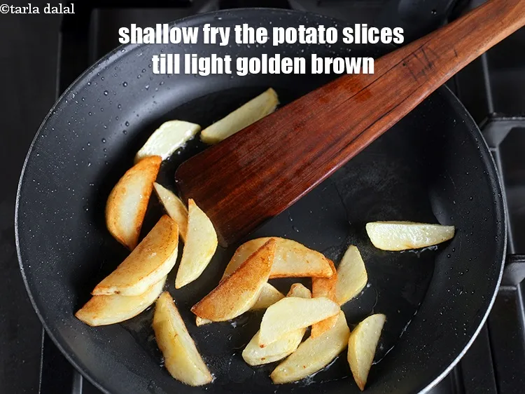Step 14 – Shallow fry the potato slices till light golden brown.