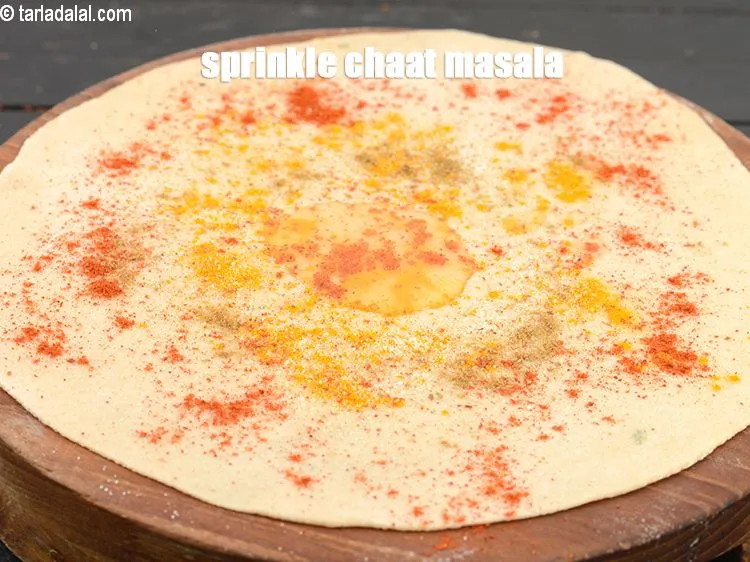 Step 14 – Sprinkle <a href="https://www.tarladalal.com/glossary-chaat-masala-300i">chaat masala</a>.