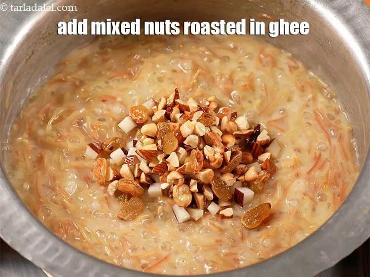 Step 14 – Add &frac14; cup chopped mixed nuts roasted in ghee.