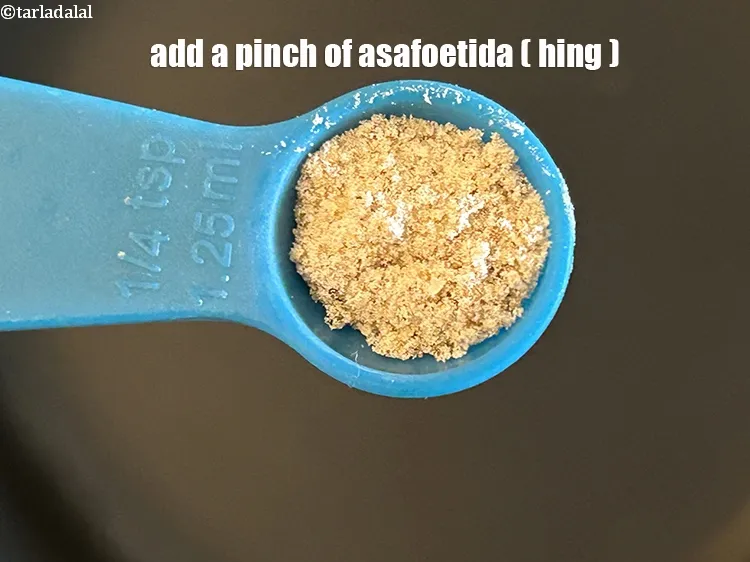 Step 20 – Add&nbsp;<meta charset="UTF-8" />a pinch of&nbsp;<a href="glossary-asafoetida-hing-113i">asafoetida (hing)</a>.