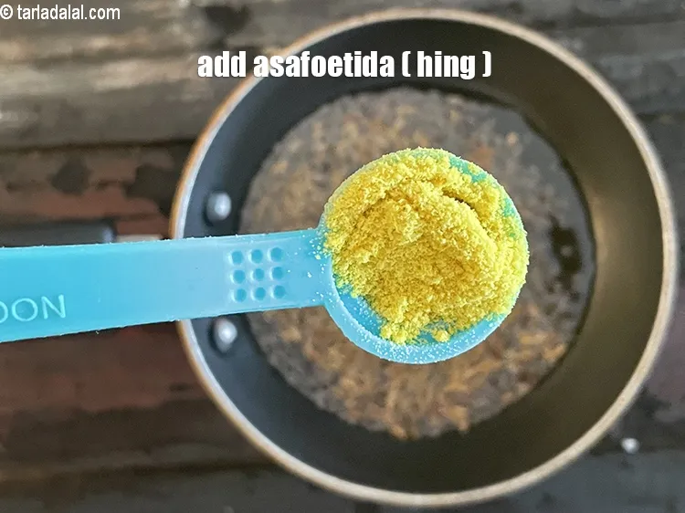 Step 23 – Add&nbsp;<meta charset="UTF-8" />1/2 tsp&nbsp;<a href="glossary-asafoetida-hing-113i">asafoetida (hing)</a>.